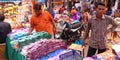 indian village shopkeeper selling colors during diwali festival at market in India Oct 2019