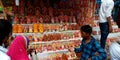 indian village shopkeeper selling colors during diwali festival at market in India Oct 2019