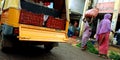 An Indian village woman loading pickup auto at agriculture market Royalty Free Stock Photo