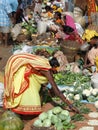 Indian villagers buy dal and other vegetables