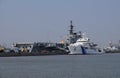 Indian Viraat aircraft carrier and Coast Guard ship anchored at a port in Mumbai