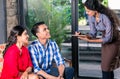 Indian waitress taking orders in cafe or restaurant