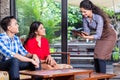 Indian waitress taking orders in cafe or restaurant