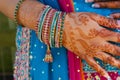 Indian wedding bride getting henna applied