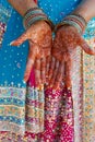 Indian wedding bride getting henna applied