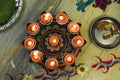 Indian wedding ceremony : Decorative oil lamp and sweet in dish