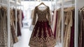 Indian wedding dress. Bridal lehenga. Bollywood red with gold wedding attire on hanger in luxury clothes shop background. Festive