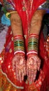 Hindu marriage girl show mehandi arm and decorative hand and wearing Varanasi sari. Royalty Free Stock Photo