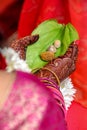 Indian wedding rituals leaf and supari in bride hand holding