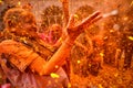 ndian Widows covered with colored powder and flower petals are seen dancing as they take part in a celebration of Holi .