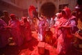 Indian Widows covered with colored powder .