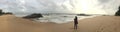 An Indian woman alone at Kundapura beach. Royalty Free Stock Photo