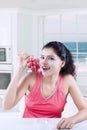 Indian woman with bunch of ripe grapes Royalty Free Stock Photo