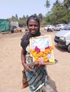 Woman with icon on Wednesday Market in Anjuna, Goa, India.