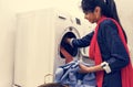 Indian woman doing a laundry washing machine