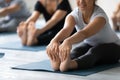 Indian woman doing Seated forward bend close up, practicing yoga Royalty Free Stock Photo