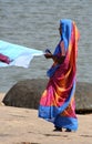 Indian woman drying laundry