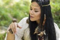 Indian woman in ethnic clothes watching a snail