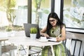 Indian woman with eyeglass using a laptop Royalty Free Stock Photo