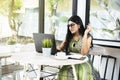 Indian woman with eyeglass using a laptop Royalty Free Stock Photo