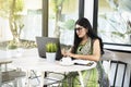 Indian woman with eyeglass using a laptop Royalty Free Stock Photo