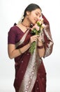 Indian woman feeling the roses Royalty Free Stock Photo