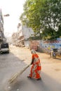 Indian Woman of the fourth Caste cleaning the streets of Jaipur, India