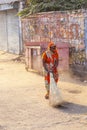 Indian Woman of the fourth Caste cleaning the streets of Jaipur, India