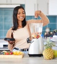 Indian woman, fruit and blender for drink in kitchen, nutrition and protein shake for detox in home. Female person