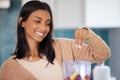 Indian woman, fruit and blender for smoothie in kitchen, nutrition and drink for detox in home. Female person, electric