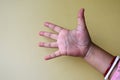 Indian woman hand shows number five . Counting gesturing, enumeration, yellow background Royalty Free Stock Photo