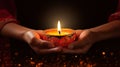 Indian woman hands holding burning diwali oil lamp over dark background Generative AI