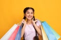 Indian woman holding colorful shopping bags at studio Royalty Free Stock Photo