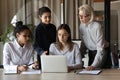 Indian woman manager discuss business idea with multiracial female colleagues Royalty Free Stock Photo