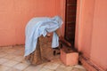 Indian woman offering food for rats, Karni Mata Temple, Deshnok, India