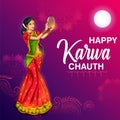 Indian woman performing Hindu married festival ritual of Karwa Cahuth looking moon through sieve