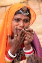 Indian woman playing on mouth harp, Jaisalmer fort, India