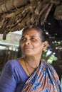 Indian woman preparing dosa at a kitchen, Auroville