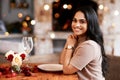 Indian woman, restaurant smile and portrait of young person ready for a romantic date. Bokeh lights, fine dining and