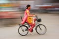 Indian woman riding bike, blurred motion, Sadar Market, Jodhpur