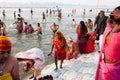 Indian woman in sari collect holy water