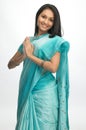 Indian woman in sari with welcome posture Royalty Free Stock Photo