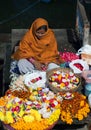 Indian woman selling pooja items in Varanasi, India Royalty Free Stock Photo