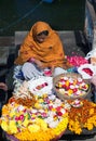 Indian woman selling pooja items in Varanasi, India