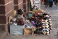 Indian woman sells shoes in street, La Paz, Bolivia