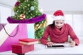 Indian woman shopping Christmas gifts online Royalty Free Stock Photo