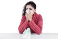 Indian woman sneezing with tissue Royalty Free Stock Photo