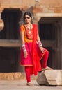 Indian woman standing in the courtyard of Quwwat-Ul-Islam mosque