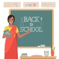 Indian woman teacher in front of a blackboard. Royalty Free Stock Photo