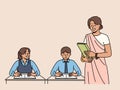 Indian woman teacher works in primary school, standing near children sitting at desks in classroom Royalty Free Stock Photo